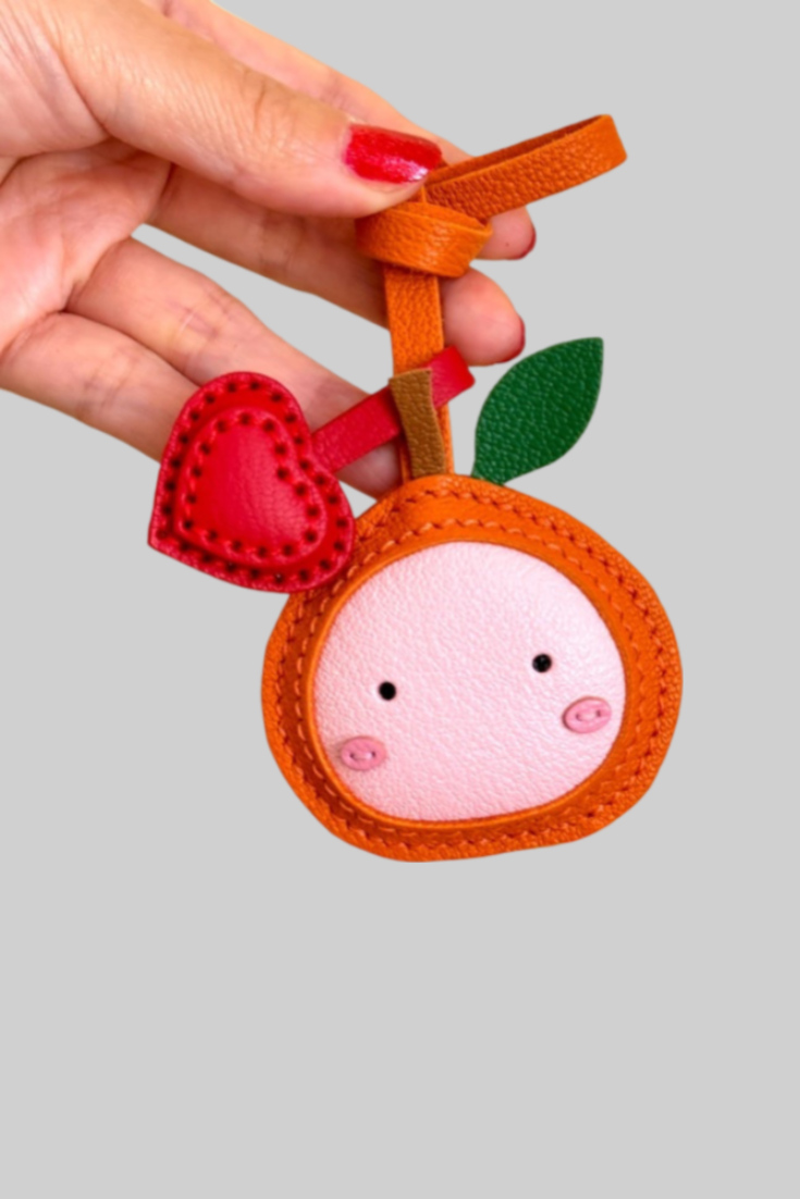 ORANGE BAG CHARM