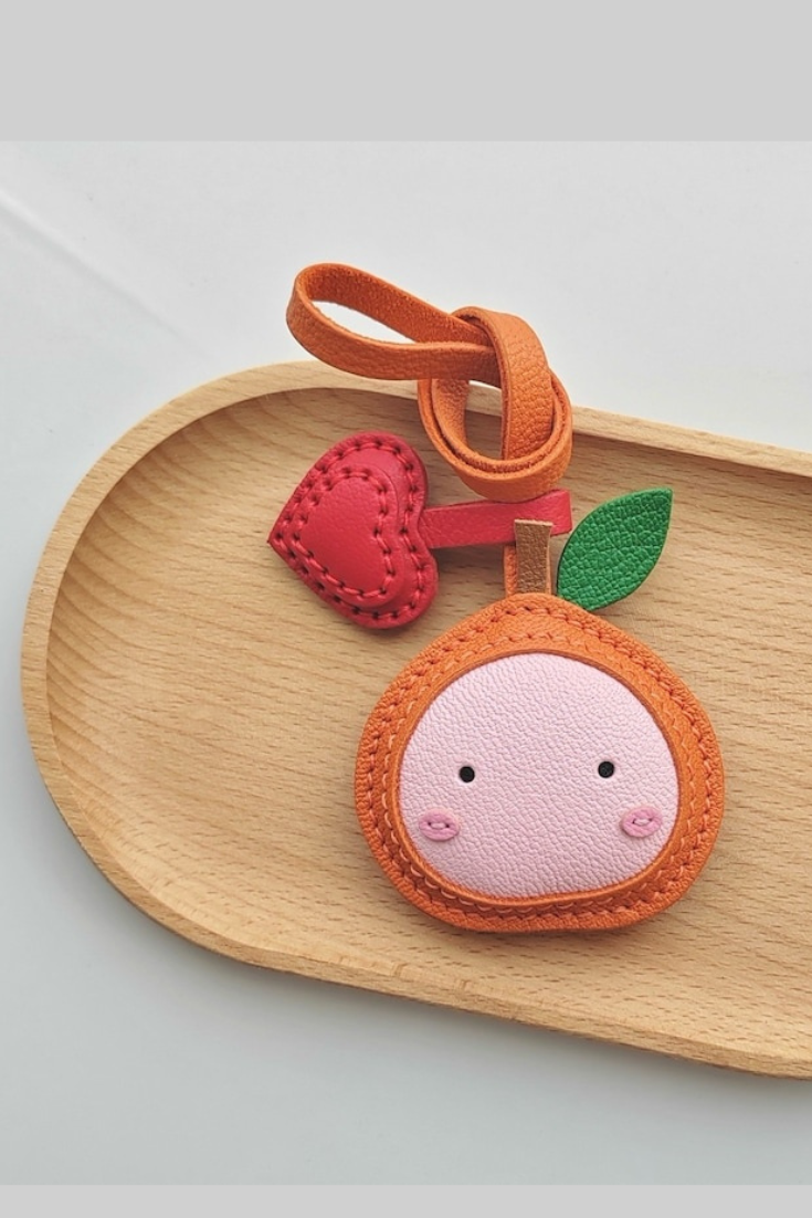 ORANGE BAG CHARM