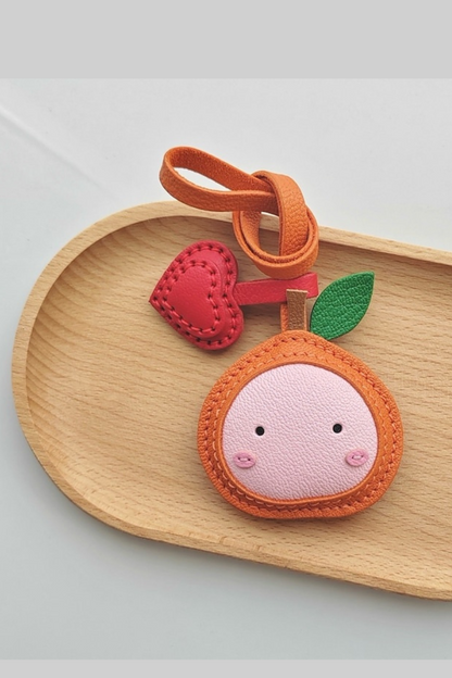 ORANGE BAG CHARM